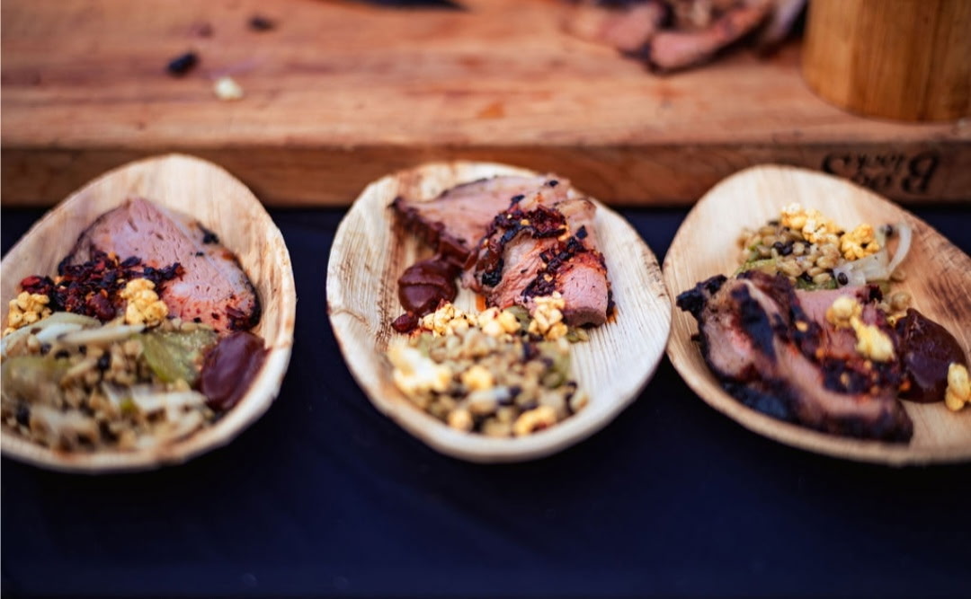 Smoked brisket trio plated on wooden bowls